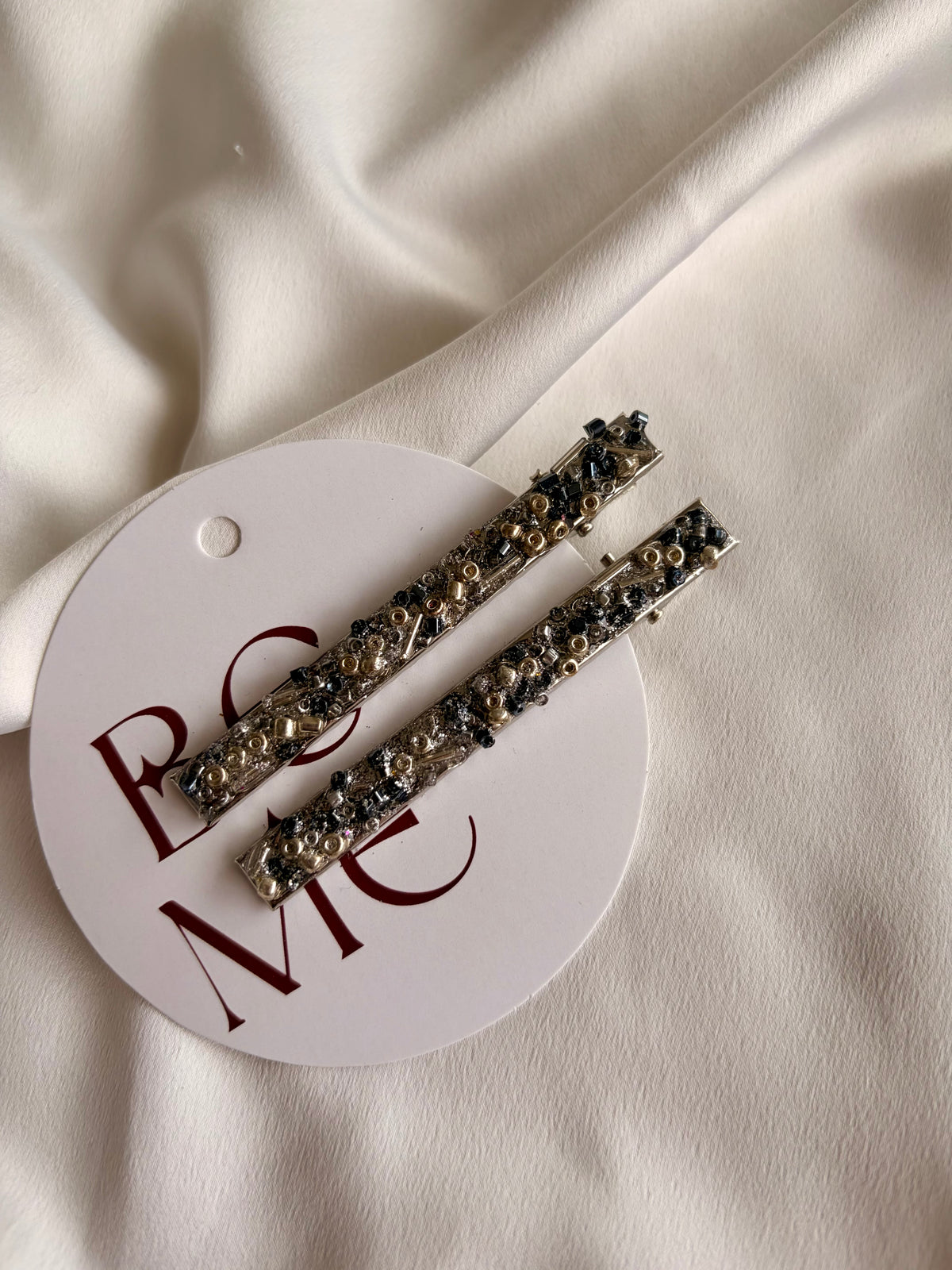 Broche Ancelmo plateado